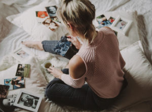 Woman looks at photos Woman looks at photos